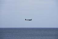 A Spitfire fighter plane over the sea in Cromer, Norfolk